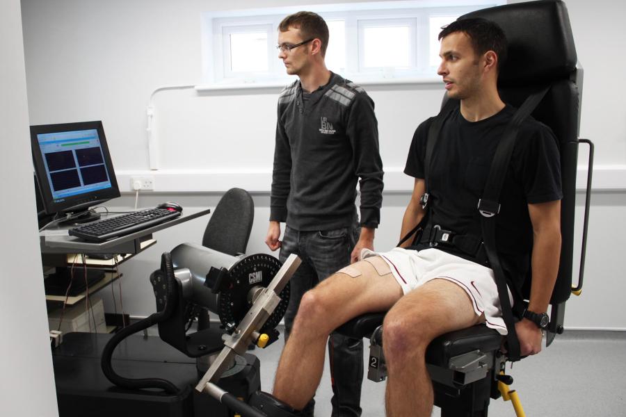 Two students testing the Sport, Health and Excercise Science equipment