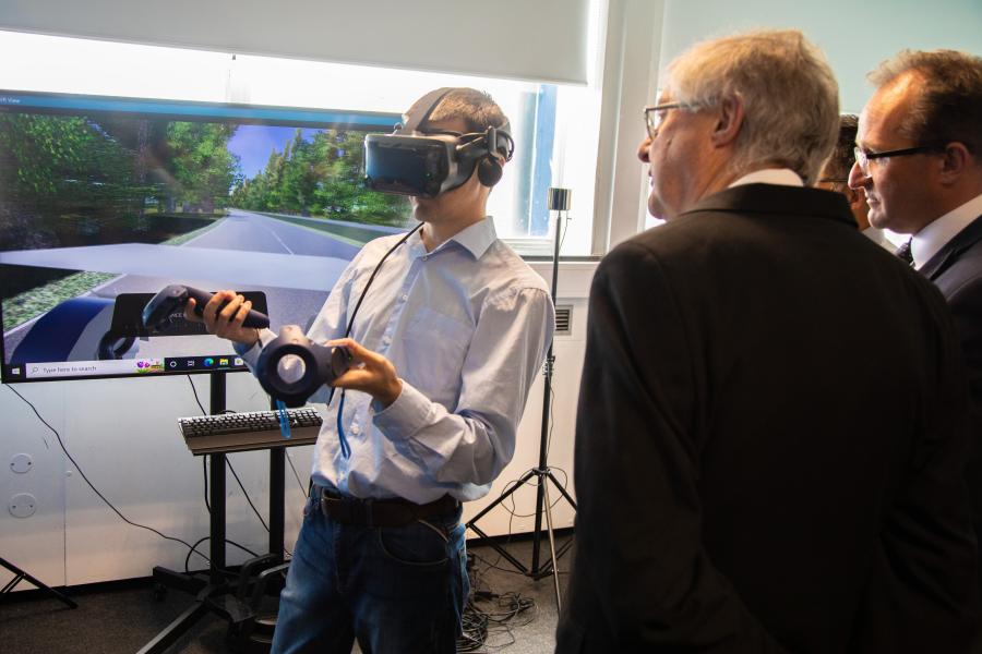 person using virtual reality headset and explaining technology