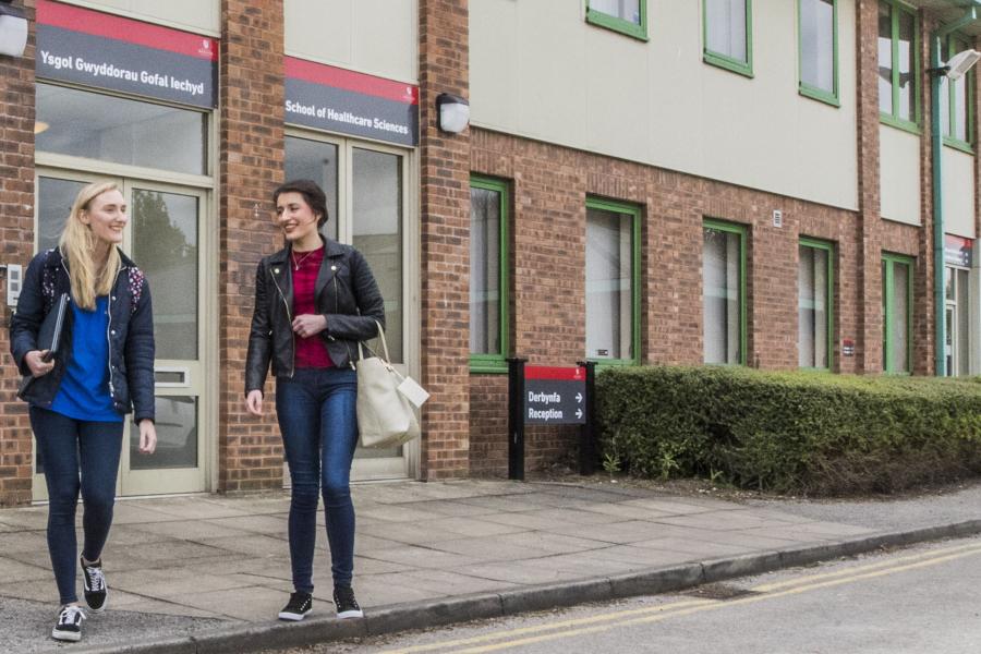 Students walking around Wrexham Campus