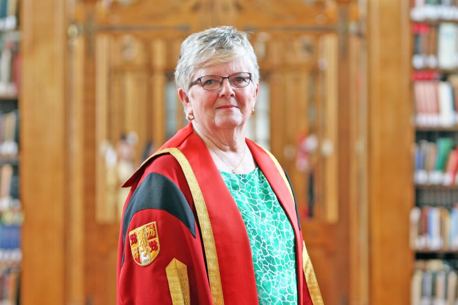 Menai Williams in Bangor University gown in Shankland Reading Room