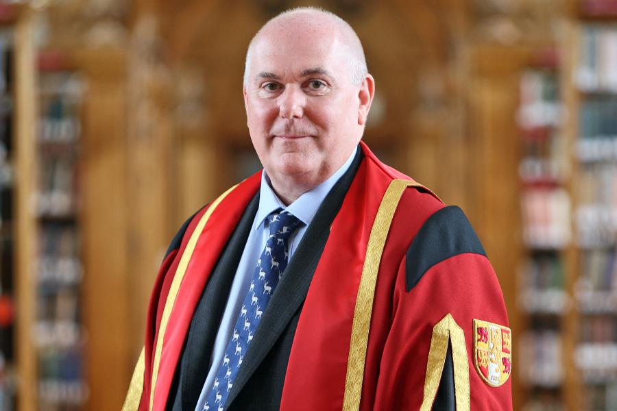 Simon Gibson in Bangor University gown in Shankland Reading Room