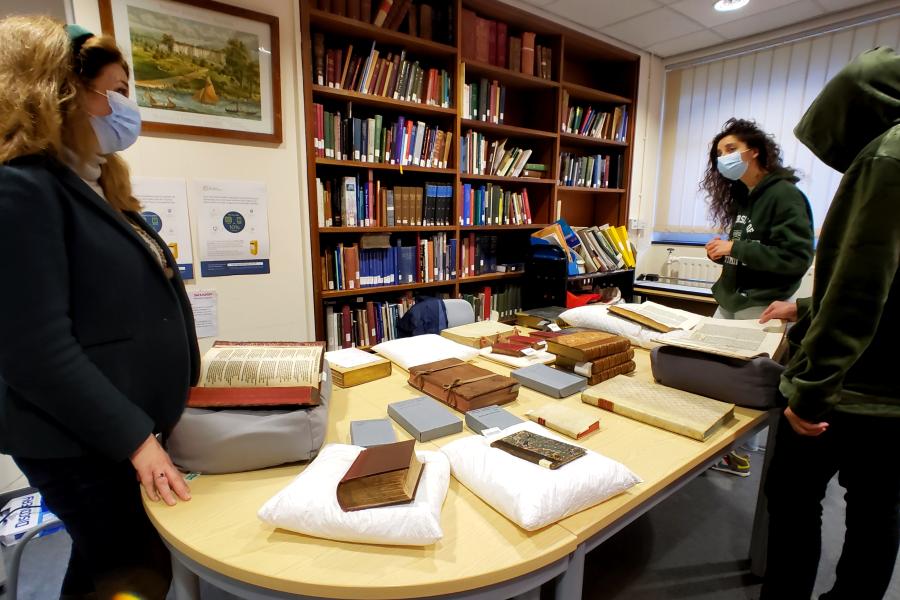 Prof Raluca Radulescu with students and medieval manuscripts