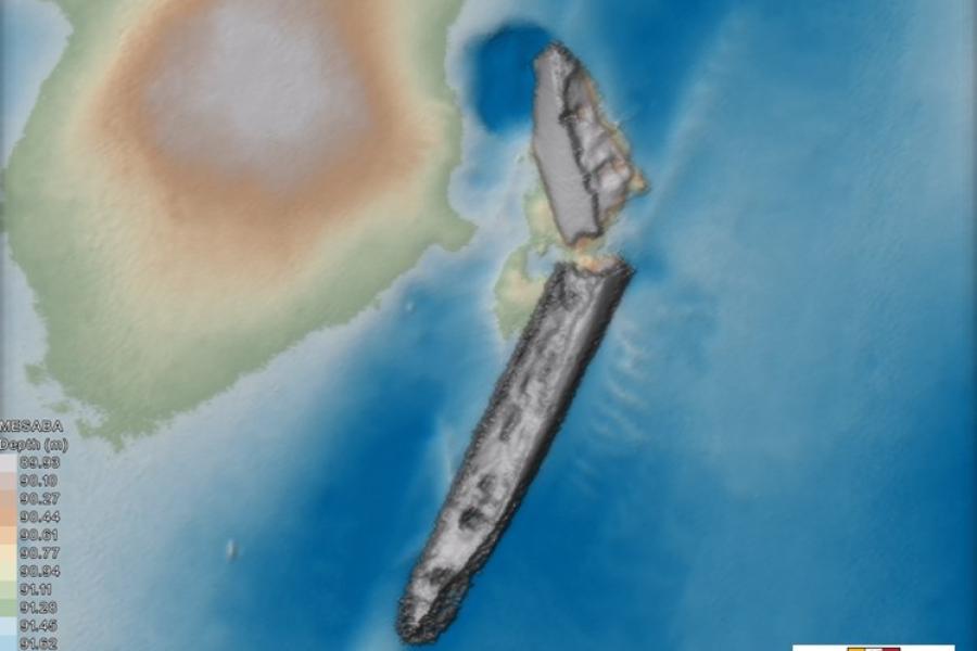 r image shows a ship lying broken in two on the sea floor