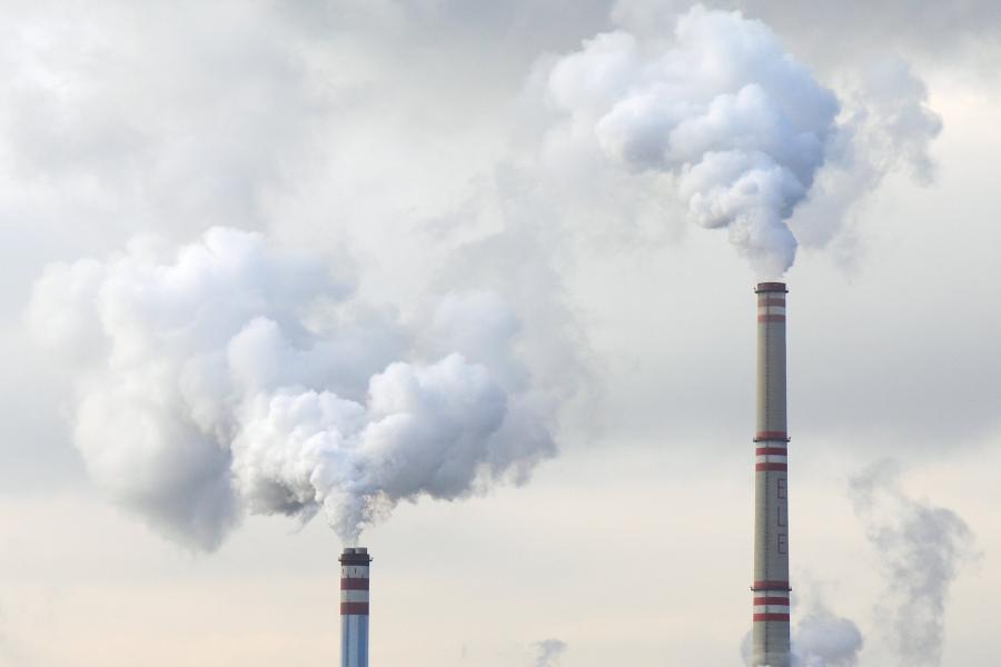 Factory chimneys releasing pollution into the atmosphere