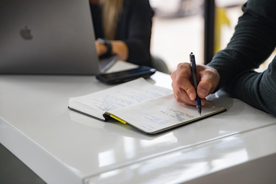 Lawyer writing in book