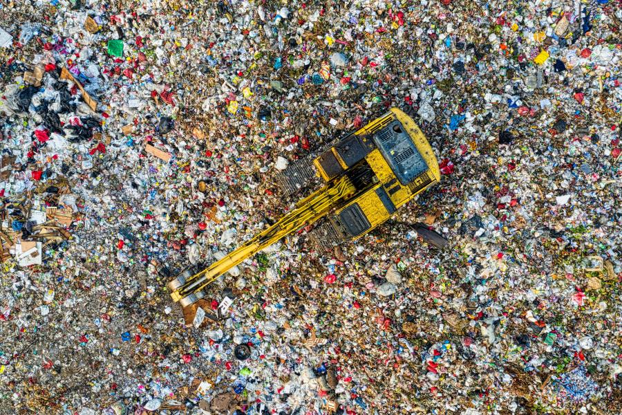 An image of a vehicle working at a landfill site