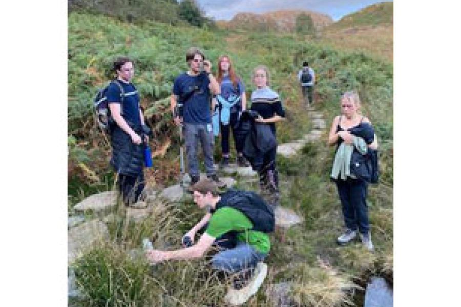 Students taking a rest near the copper mine entrance