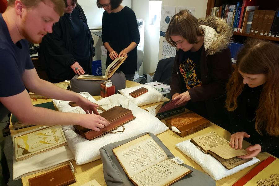 Students handling rare books
