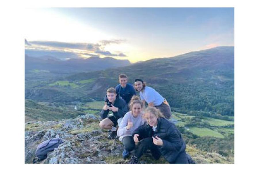 a small group of hikers posing