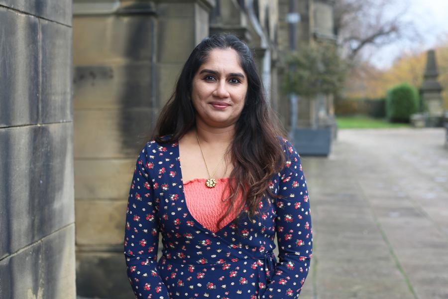 Doctoral School Administrator Aashu Jayadeep on the Terrace, outside Main Arts Building