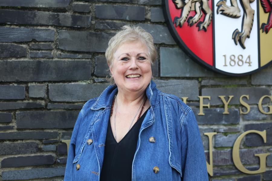 Penny Dowdney outside Main Arts' Terrace, wearing a denim jacket