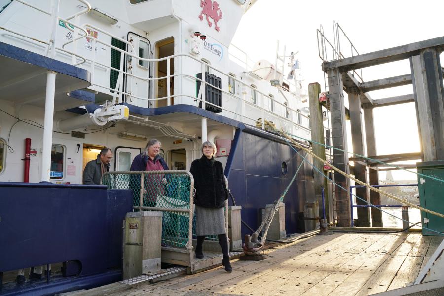 UKRI Chief Executive Professor Dame Ottoline Leyser is shown the Prince Madog Research Vessel at the Marine Centre Wales, Anglesey, by Bangor University’s Dr Shelagh Malham and Professor Paul Spencer