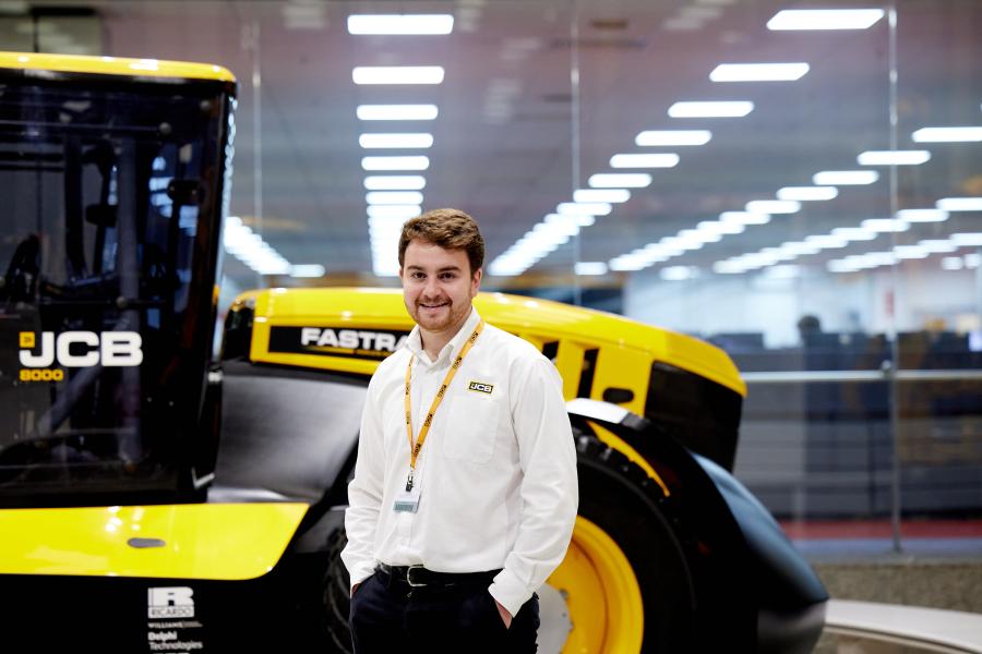 Charlie Small, Product Design graduate, with JCB machinery