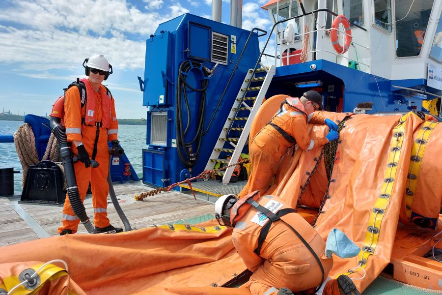 Dan Lambley, a Bangor graduate, at work during an oil spill response exercise