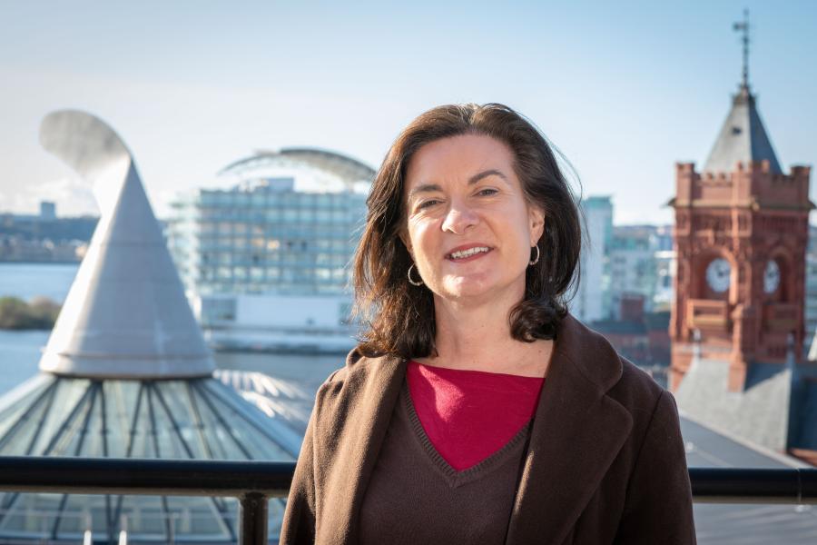 Eluned Morgan standing in the Cardiff Bay area