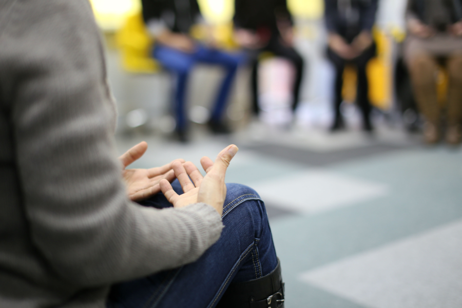 A group of people sitting in a room