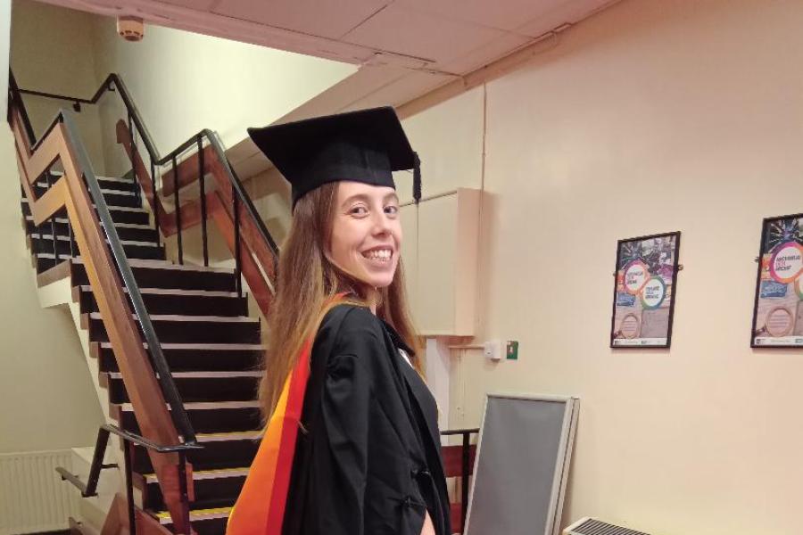 Gemma Tooze on her graduation day smiling to camera