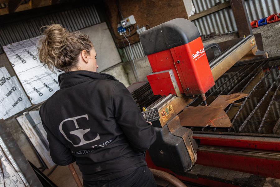Victoria Rushton, Product Design graduate using workshop machinery in the workplace