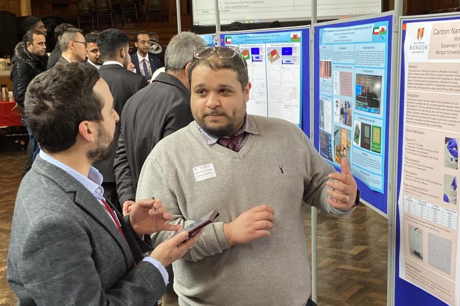 Dr Daniel Roberts talks with Mohammed Al-Herz (BENG Electronic Engineering)