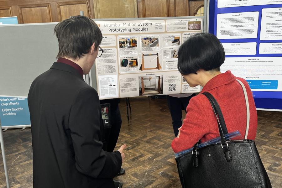 Dr Yanhua Hong talking with student Sean Price