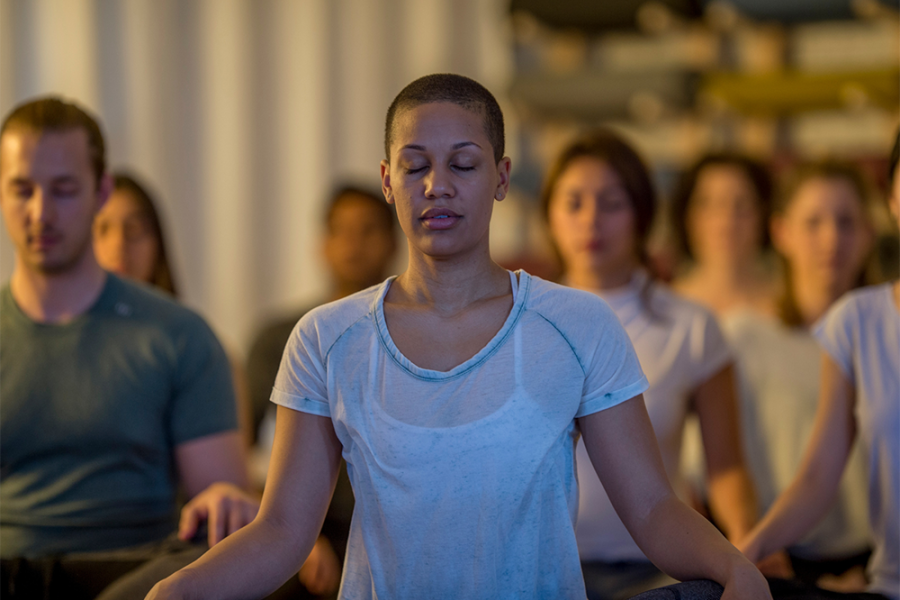 A group of people in a meditation class