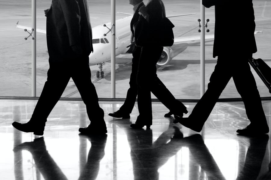 People walking in the airport to catch the plane 