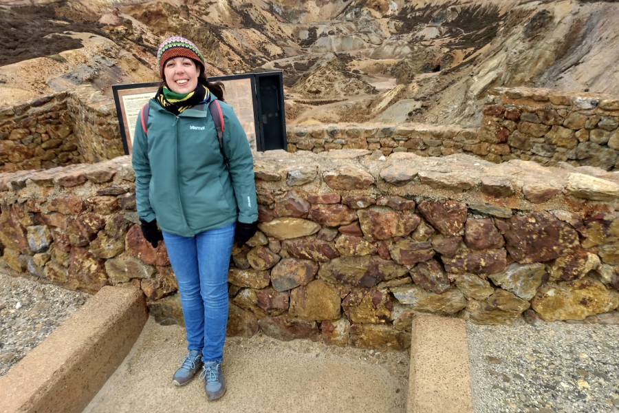 Katie Devenish standing in front of an excavation area