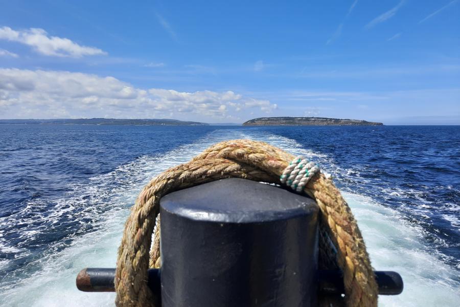 Blue sea with island in the background