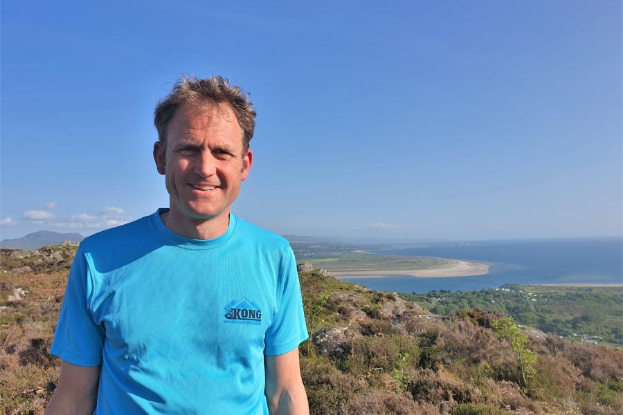 Man with view of landscape behind him