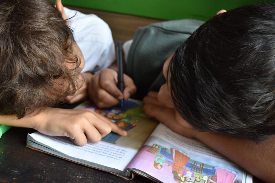 two boys working at a desk