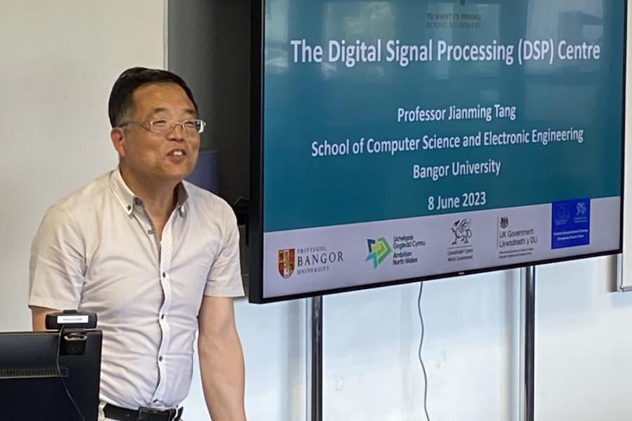 Professor Jianming Tang presenting the Digitial Signal Processing Centre. 