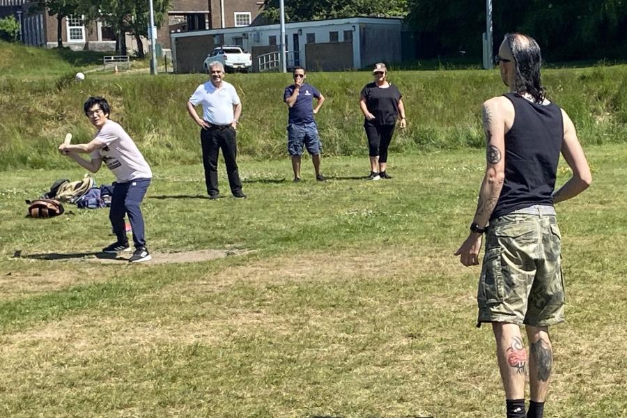 Staff and students playing rounders
