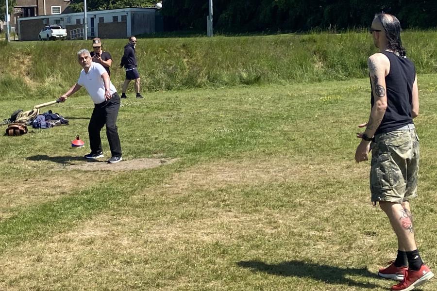 Staff and students playing rounders