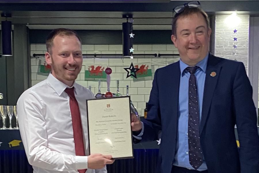 Daniel Roberts receiving his award from Dr Iestyn Pierce (Head of School)