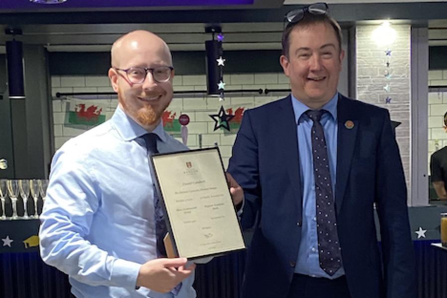 Daniel Lambert receiving his award from Dr Iestyn Pierce (Head of School)