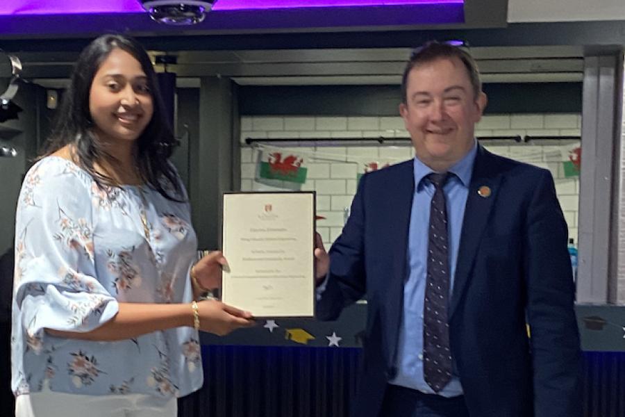 Gawina Fernandes receiving her award from Dr Iestyn Pierce (Head of School)