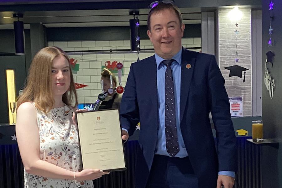 Sophie Jolley receiving her award from Dr Iestyn Pierce (Head of School)