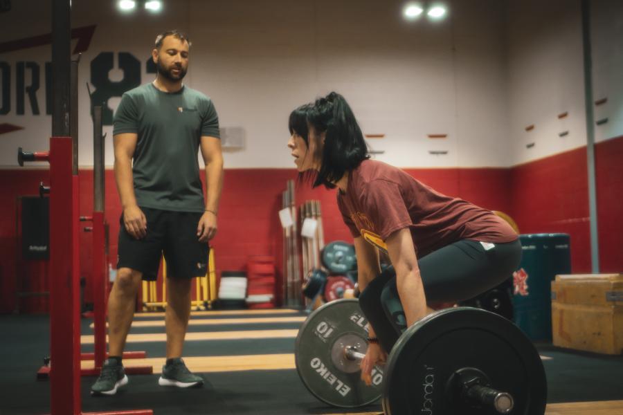 Image of personal trainer and weightlifting