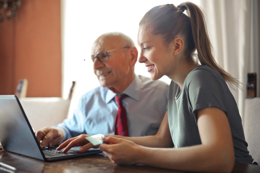 Woman and a man looking at a computer screen. 