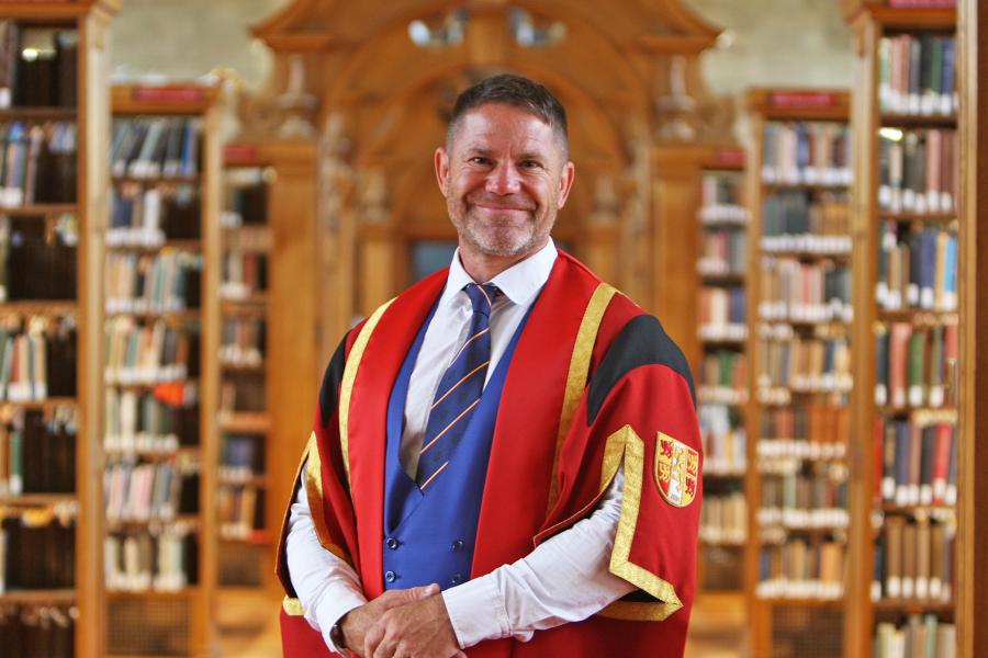 Steve Backshall in Bangor University Library in graduation gown