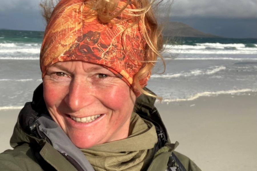 Rosemary on the beach, wearing a headband