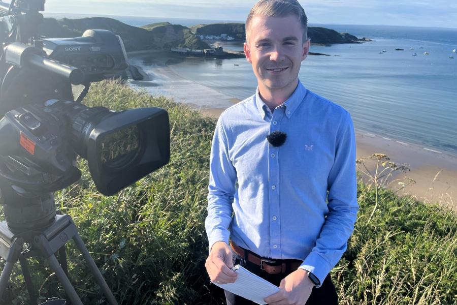 Liam Smiling to Camera with beach backdrop