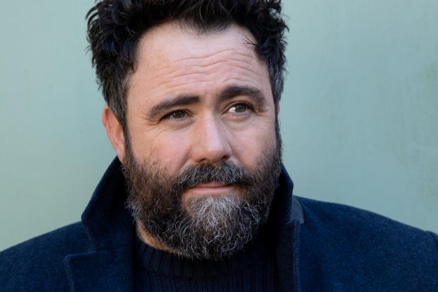 Head and shoulders shot of actor Celyn Jones