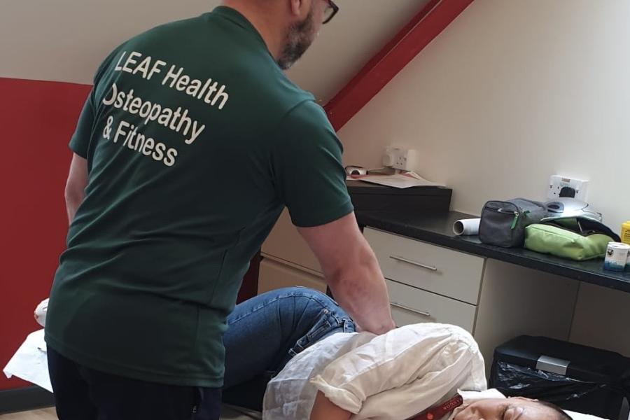 Physiotherapist treating a patient