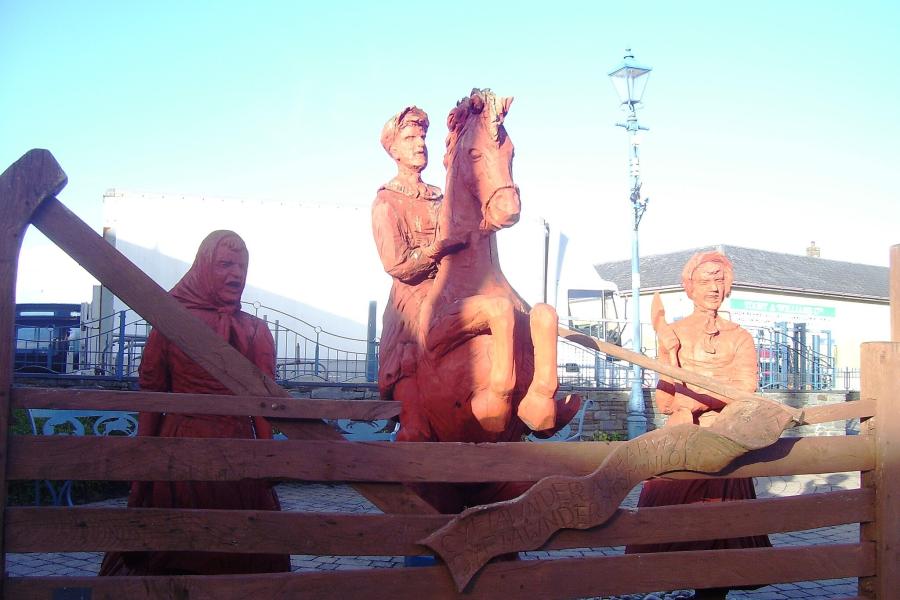  a wooden carving commemmorating the Rebecca Riots in west Wales.