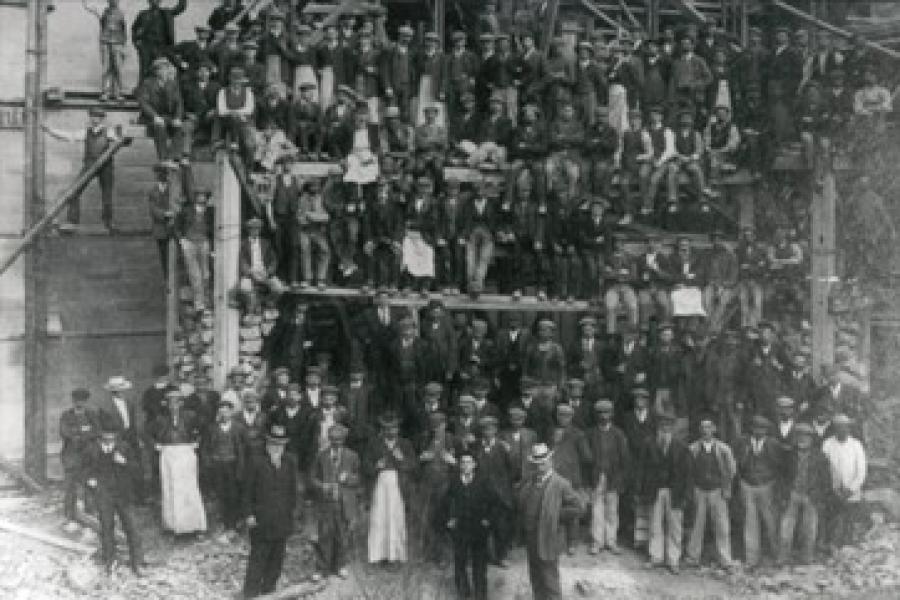 large group of workmen posing for a picture whilst building Bnagor University