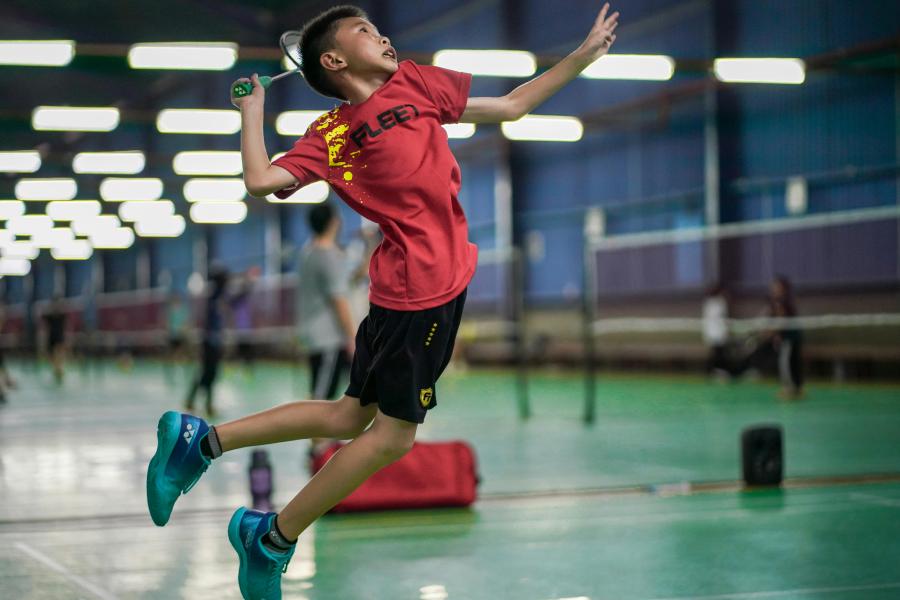 Young Boy playing Badminton