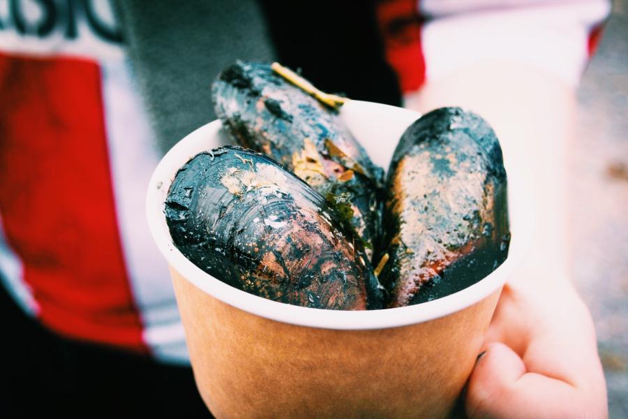 Wood fired mussels in a take-away cup 