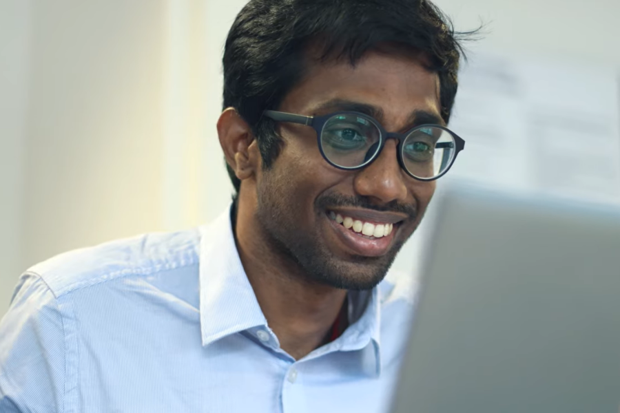 Image of Sakthi Sundharam in front of a laptop