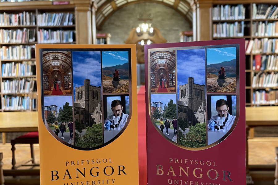 Two pocket prospectus on a table in the Shankland Library